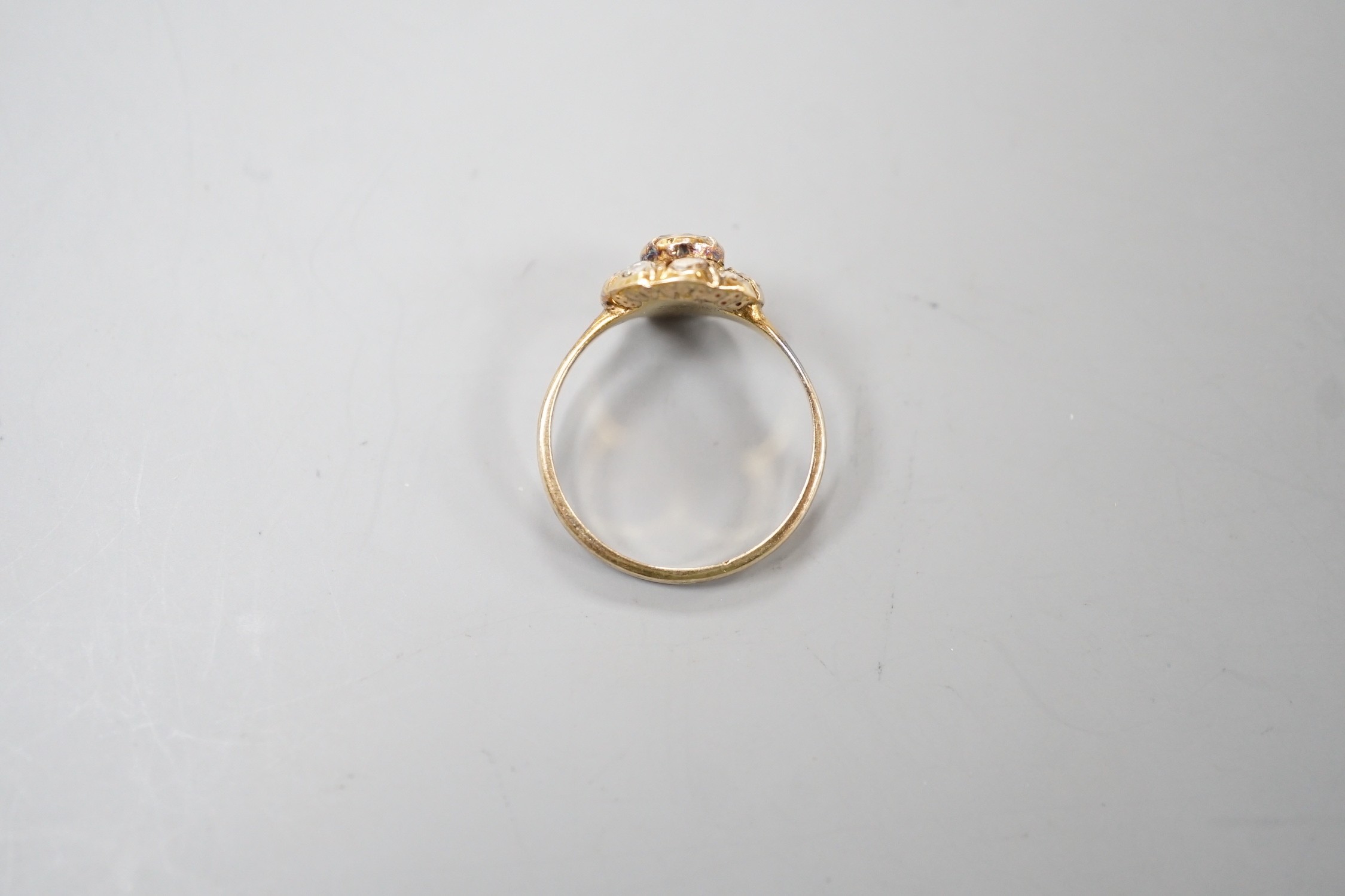 An antique yellow metal and rose cut diamond cluster set ring, size K/L, gross weight 3.2 grams.